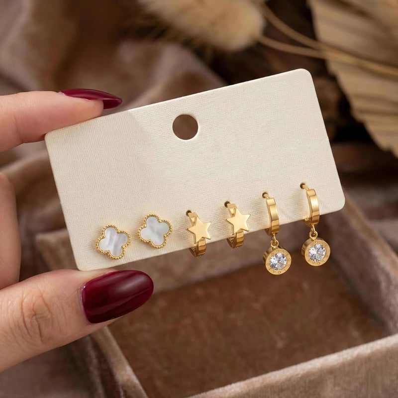A set of 3 pairs of exquisite gold earrings: a mother-of-pearl rose hoop, a delicate star hoop, and dangling circles with sparkling cubic zirconia stones. Made of durable stainless steel, an irresistible combination. - Image 5